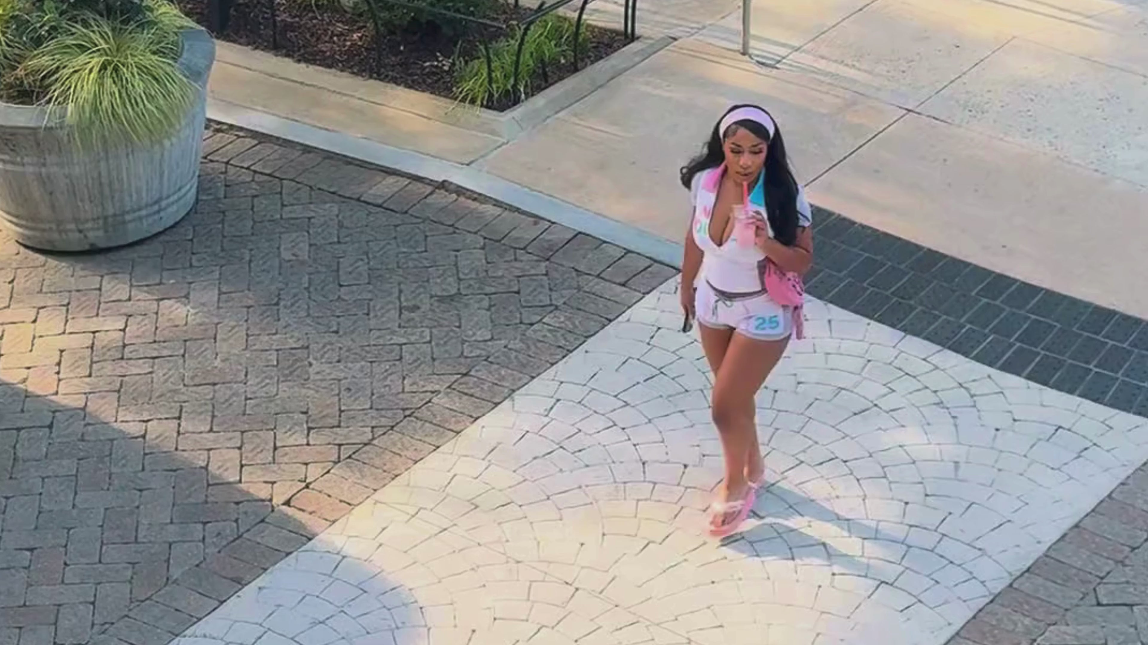 Load video: a model wearing nkd running across shopping plaza with a matcha